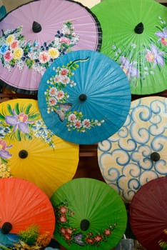 Traditionall umbrellas and faechers from Paier are produced in a paper screen factory in Chiang Mai in the north of Thailand in South East Asia.