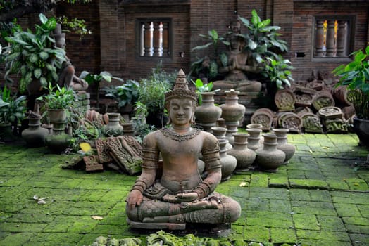 Traditional figures are available for sale in the garden of Ban Phor Linag Meun's Terracota Art at Terracota Garden in Chiang Mai in northern Thailand in South East Asia.