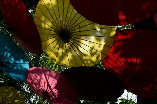 Traditionall umbrellas and faechers from Paier are produced in a paper screen factory in Chiang Mai in the north of Thailand in South East Asia.