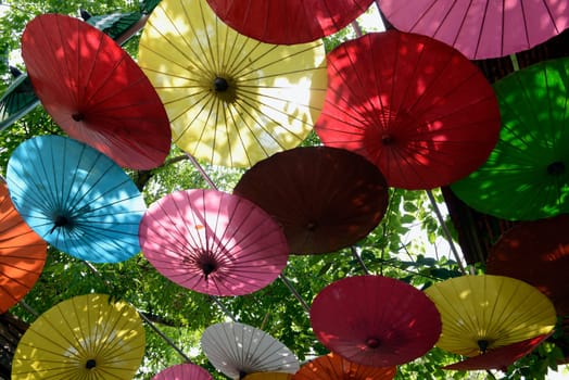 Traditionall umbrellas and faechers from Paier are produced in a paper screen factory in Chiang Mai in the north of Thailand in South East Asia.