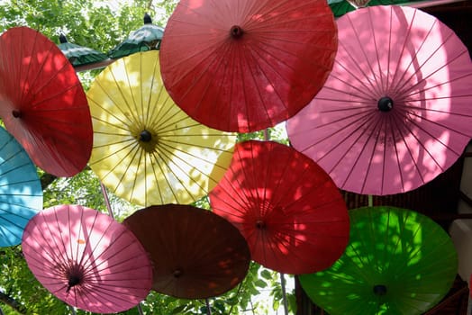 Traditionall umbrellas and faechers from Paier are produced in a paper screen factory in Chiang Mai in the north of Thailand in South East Asia.
