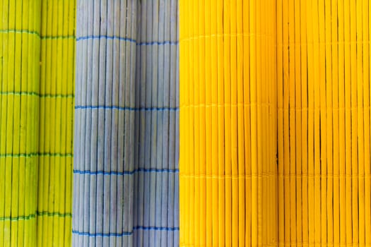 Tablecloths folders three different colors with a textured wooden branches