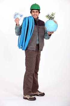 Construction worker holding a globe