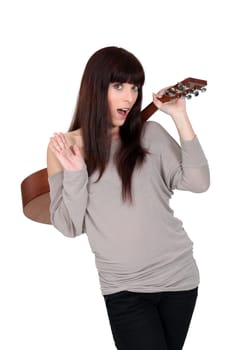 woman holding a guitar