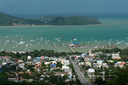 The view from the mountains to Chalong in the south of the island of Phuket in the south of Thailand in South East Asia.