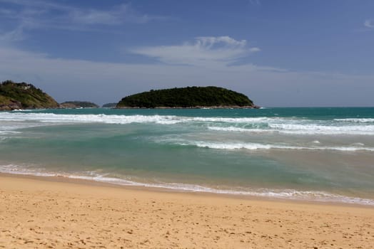 A beach in Hat Nai Harn in the south of phuket island in southern Thailand in South East Asia.