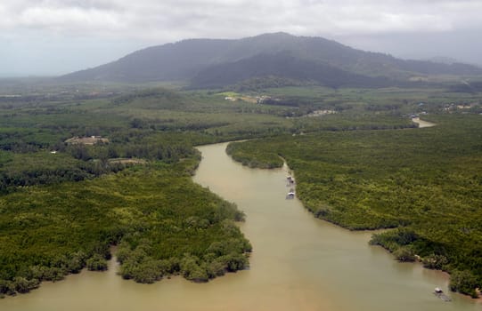 The landscape at Hat Mai Khao on the island of Phuket in the south of Thailand in South East Asia.