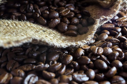 Coffee beans inside his jute bag with side lighting