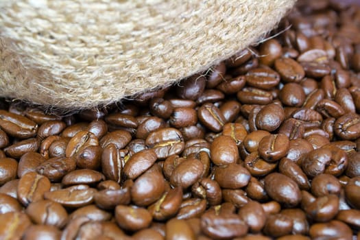 Details of coffee beans and jute bag texture