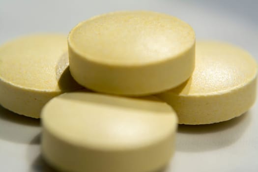 Macro to a round yellow pills
