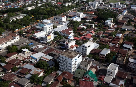 The view of the city of Ubon Rachathani in the Isan on the approach from Chiang mai to Ubon in northeastern Thailand.