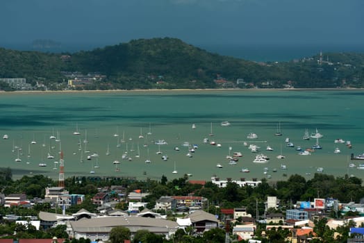 The view from the mountains to Chalong in the south of the island of Phuket in the south of Thailand in South East Asia.