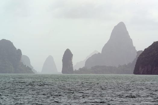 Limestone rocks and hollows in the Ao Phang Nga National Park a few minutes by boat from the main island of Puket on the island of Phuket in the south of Thailand in South East Asia.