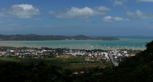 The view from the mountains to Chalong in the south of the island of Phuket in the south of Thailand in South East Asia.