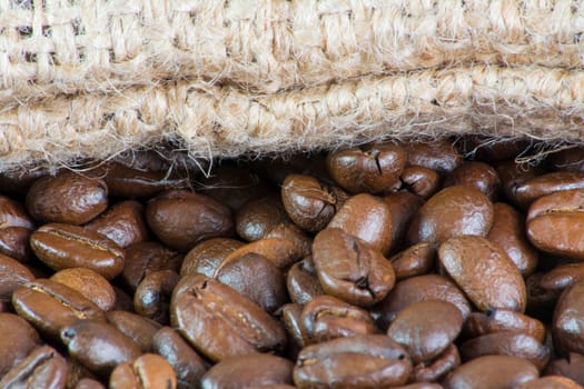 Details of coffee beans and jute bag texture
