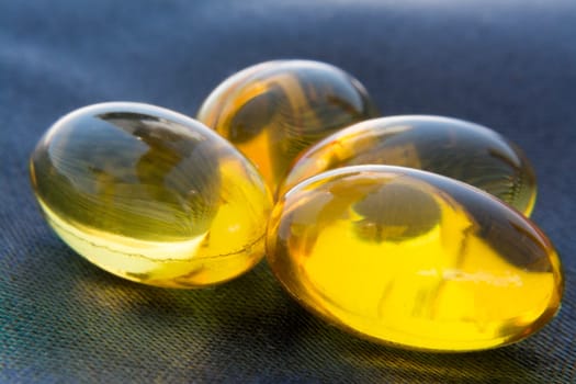 Macro To A Yellow Pills With Blue Background