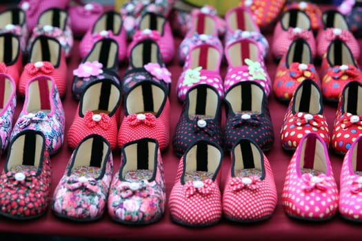 Coloured shoes on the market at the Bun Bang Fai or Rocket Festival in Yasothon in the Isan in northeastern Thailand.