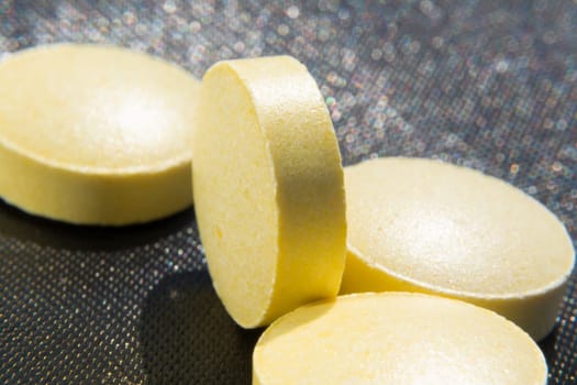 Macro to a round yellow pills