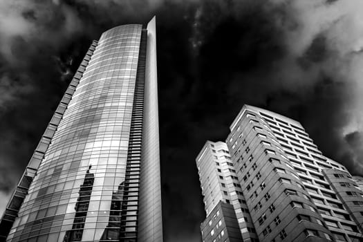 Couple of buildings in high contrast black and white.