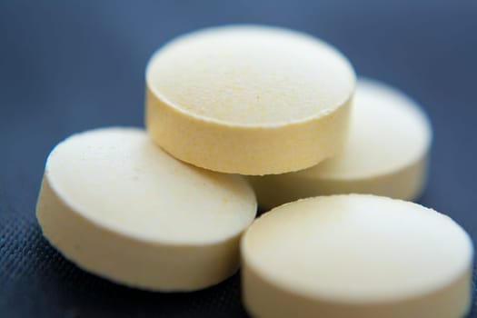 Macro to a round yellow pills
