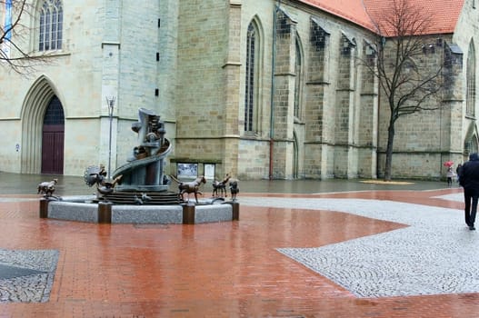 Hamm,Germany – February 01,2014: A fountain with animal motifs on the market square at Pauluskirche on February 1,2014 in Hamm.