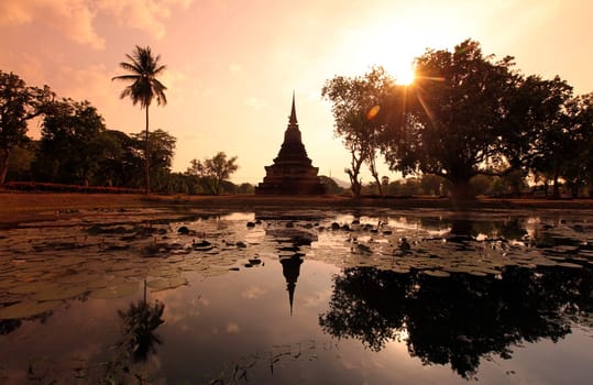 A chedi at the Wat Mahathat Temple in the temple complex of Alt-Sukhothai in Sukhothai province in northern Thailand in South East Asia.