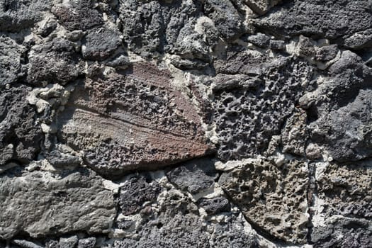 Wall of volcanic rock and cement to detail