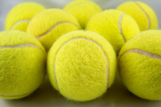 Approaching tennis balls set. You can see the texture of the fibers and fluoresce