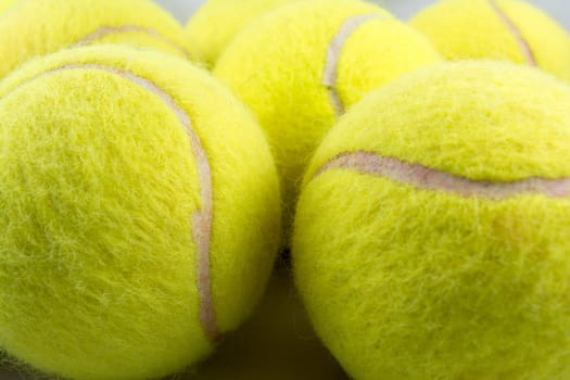 Approaching tennis balls set. You can see the texture of the fibers and fluoresce