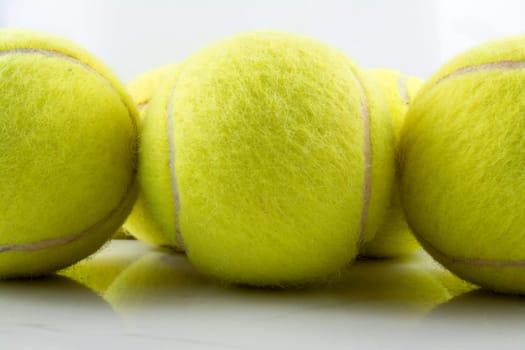 Approaching tennis balls set. You can see the texture of the fibers and fluoresce