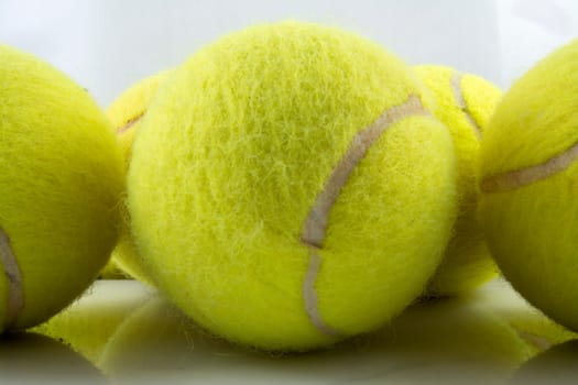 Approaching tennis balls set. You can see the texture of the fibers and fluoresce