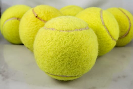 Approaching tennis balls set. You can see the texture of the fibers and fluoresce