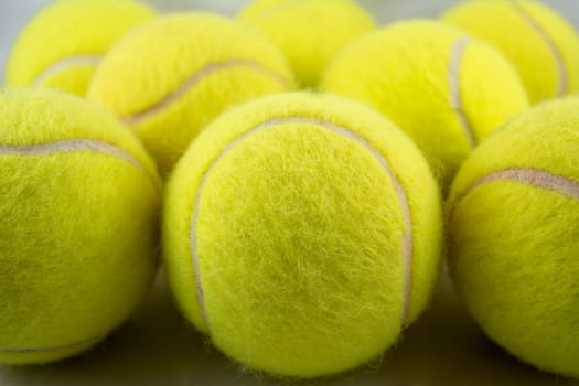 Approaching tennis balls set. You can see the texture of the fibers and fluoresce