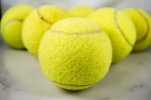 Approaching tennis balls set. You can see the texture of the fibers and fluoresce