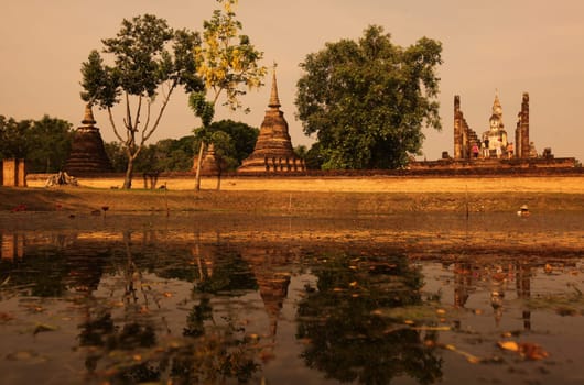 A chedi at the Wat Mahathat Temple in the temple complex of Alt-Sukhothai in Sukhothai province in northern Thailand in South East Asia.
