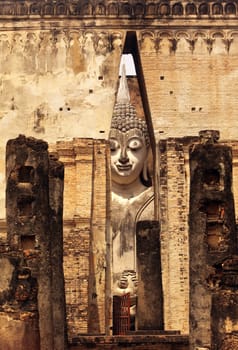 The Buddha figure in the Wat Si Chum temple in the temple complex of Alt-Sukhothai in the province of Sukhothai in northern Thailand in South East Asia.