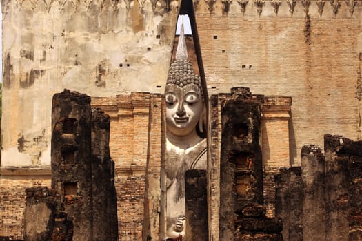 The Buddha figure in the Wat Si Chum temple in the temple complex of Alt-Sukhothai in the province of Sukhothai in northern Thailand in South East Asia.