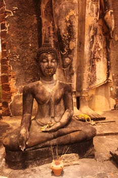 A Buddha figure at Wat Saphan Hin Temple in the temple complex of Alt-Sukhothai in Sukhothai Province in northern Thailand in South East Asia.