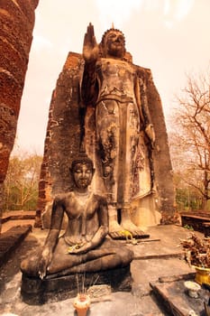 A Buddha figure at Wat Saphan Hin Temple in the temple complex of Alt-Sukhothai in Sukhothai Province in northern Thailand in South East Asia.