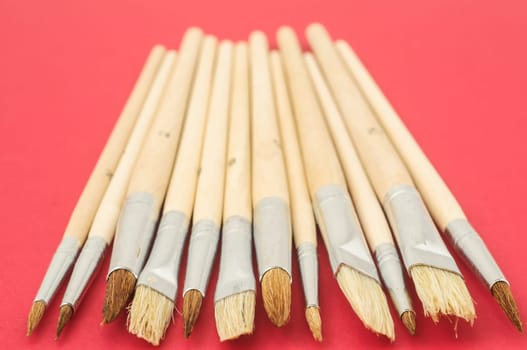 New Wooden Different Paintbrush Set Texture over a Colored Background