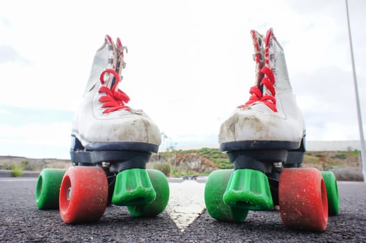 Old Vintage White Skate Boot on the Asphalt Sterret