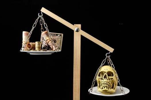 Skull and Money on a Two Pan Balance