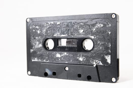 Ancient Vintage Used Musicassette over a White Background