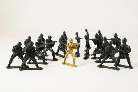 Plastic Lead Soldiers Representing War on a White Background