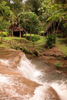Die Landschaft mit einem Wasserfall beim Dorf Fang noerdlich von Chiang Mai im Norden von Thailand.