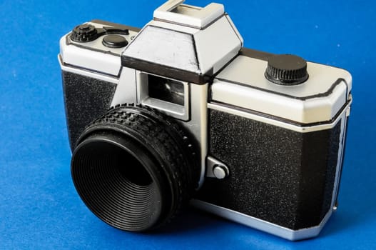 Classic 35mm Plastic Toy Photo Camera on a Colored Background