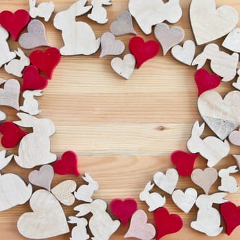 Background made of wood with hearts and Easter bunnies