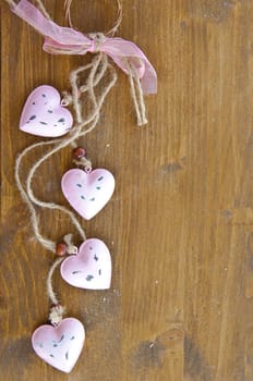 Wooden background with colorful hearts