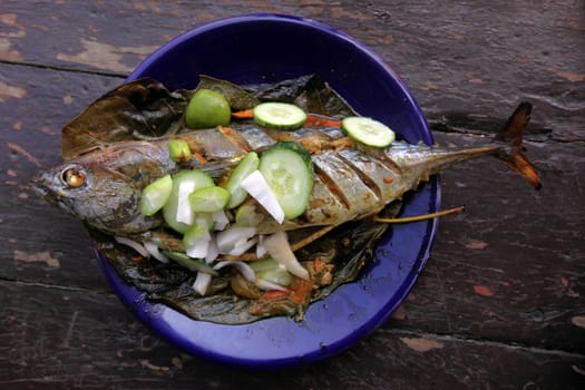 A grilled fish menu on the island of Ko Tao in the Gulf of Thailand in the south-west of Thailand in South East Asia.