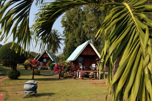 A bungalow on the beach at Chumphon at the ship station for the onward to the island of To Tao in the Gulf of Thailand in the south-west of Thailand in South East Asia.